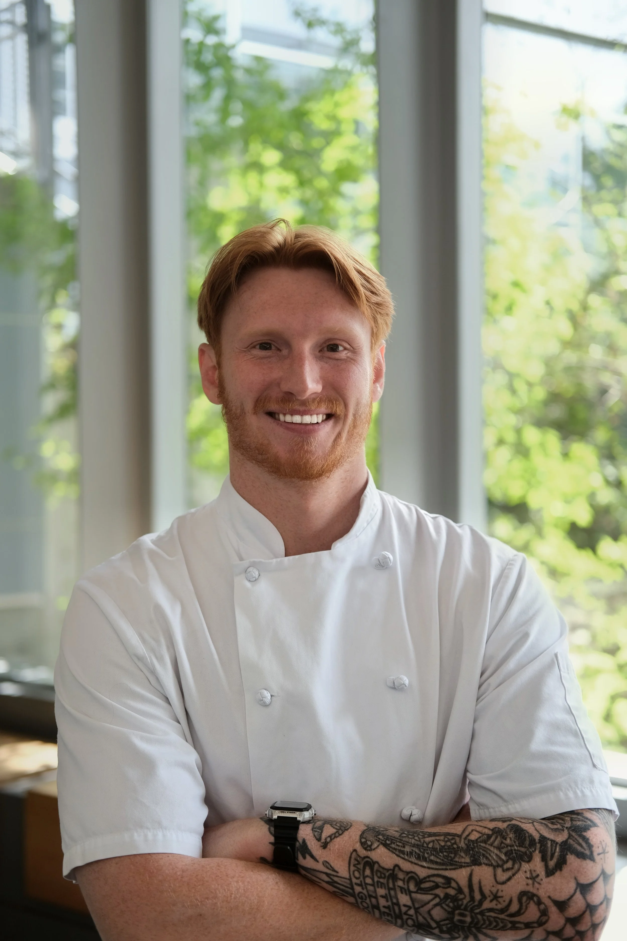 Ethan J. Allwood, founder of Kitchen Counts, in chef whites